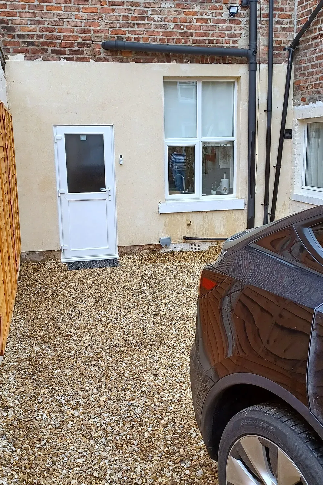 Private off-street parking space on the gravel behind the house